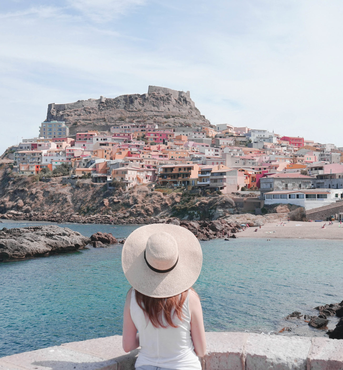 Castelsardo, Sardinia, Italy. The town is a small Medieval jewel right on the little hill with the colorful houses, turquoise seas & white sand beaches and looks like a dream. Perfect for the lunch stop and a quick dip to cool down from the heat on the island in September.