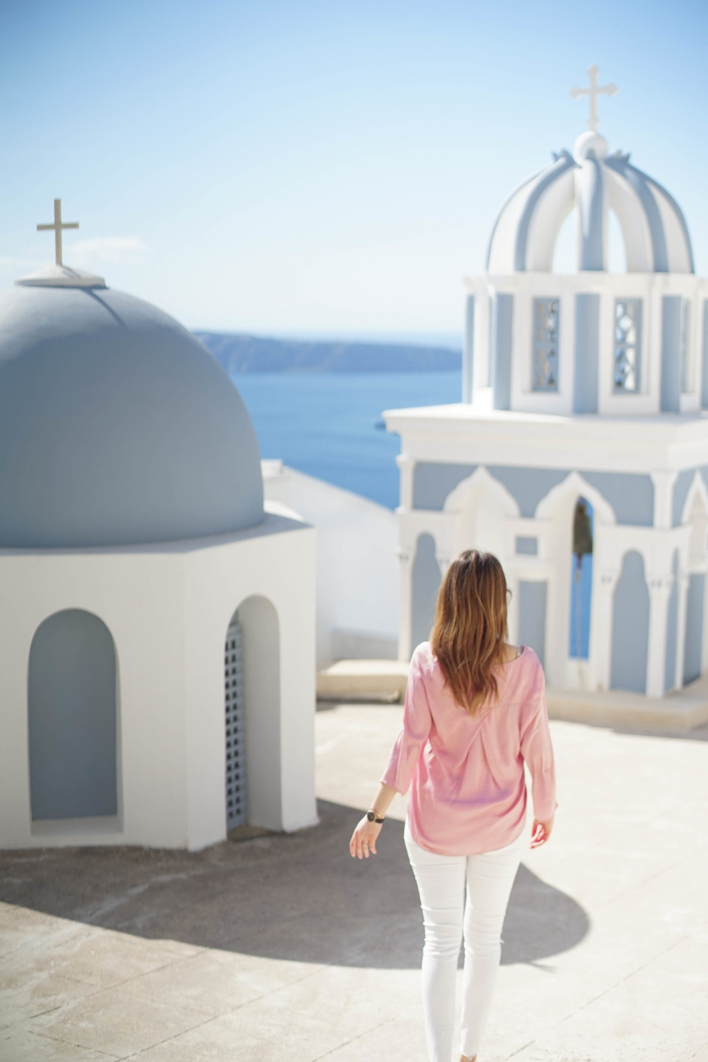 Firostefani has many white blue churches. The shades are brighter and softer than those in Oia.