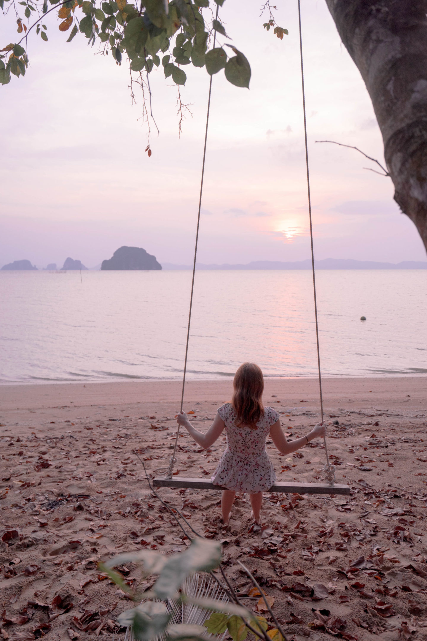 swinging into sunset in krabi