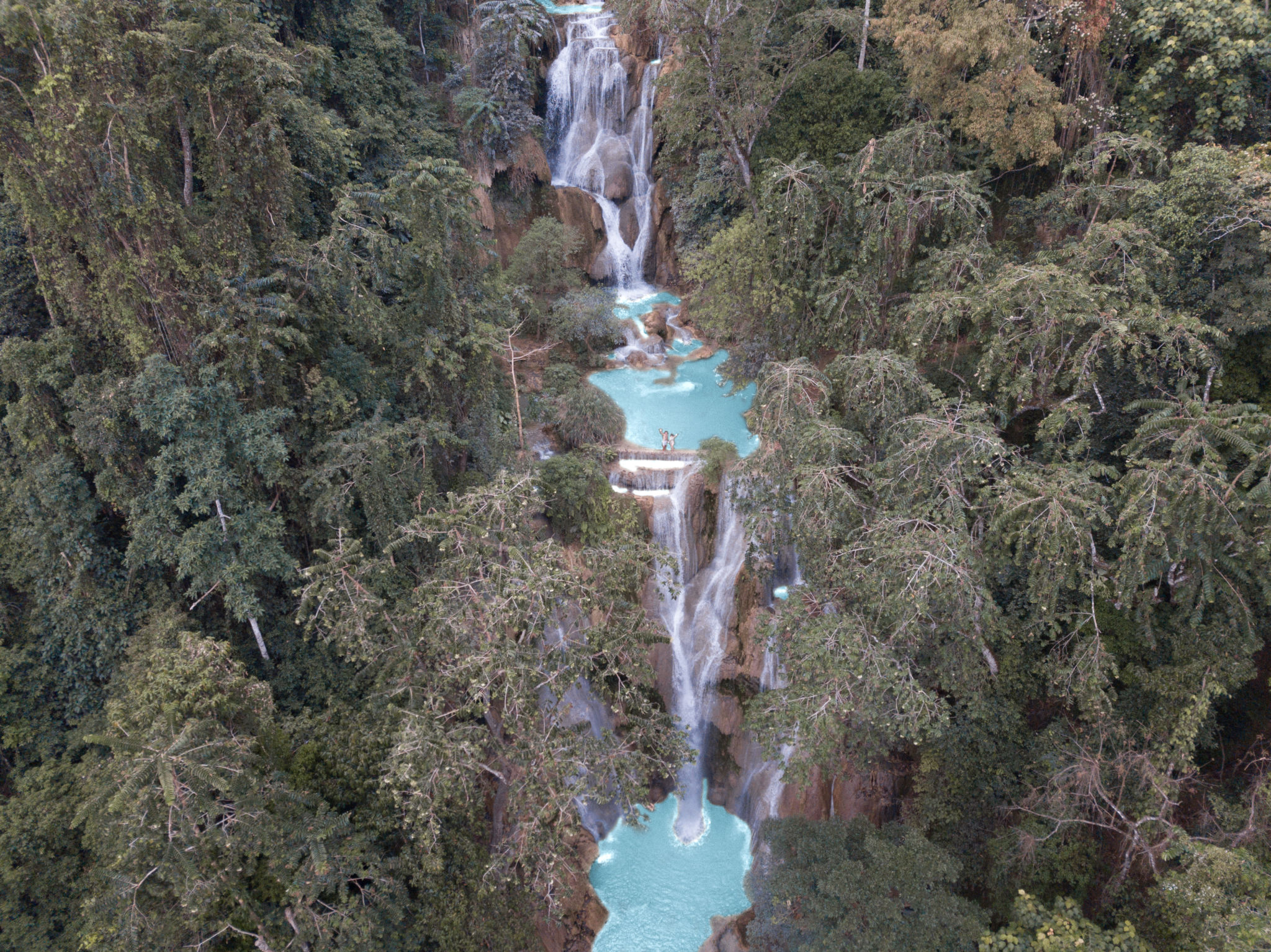 On top of Kuang Si Waterfalls Laos - travel the world full time or not?